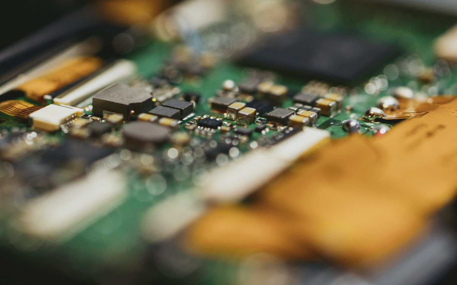 Close-up of a green circuit board with electronic components