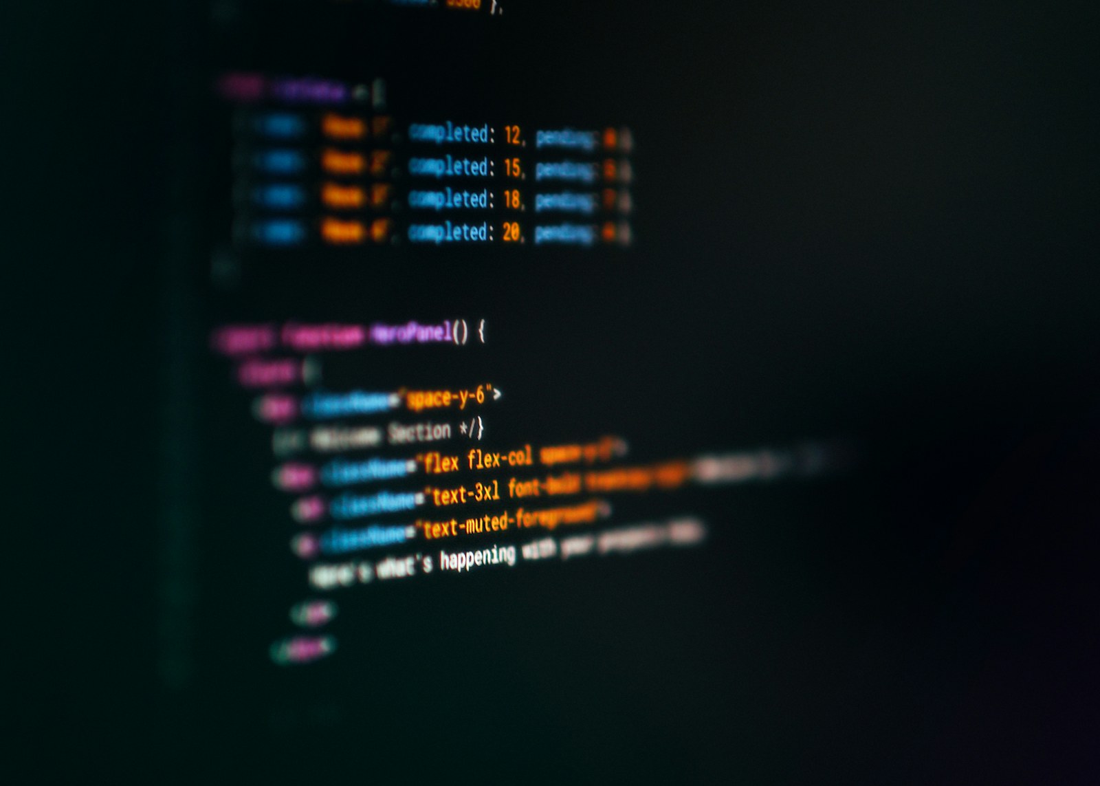 Computer screen displaying colorful code snippets