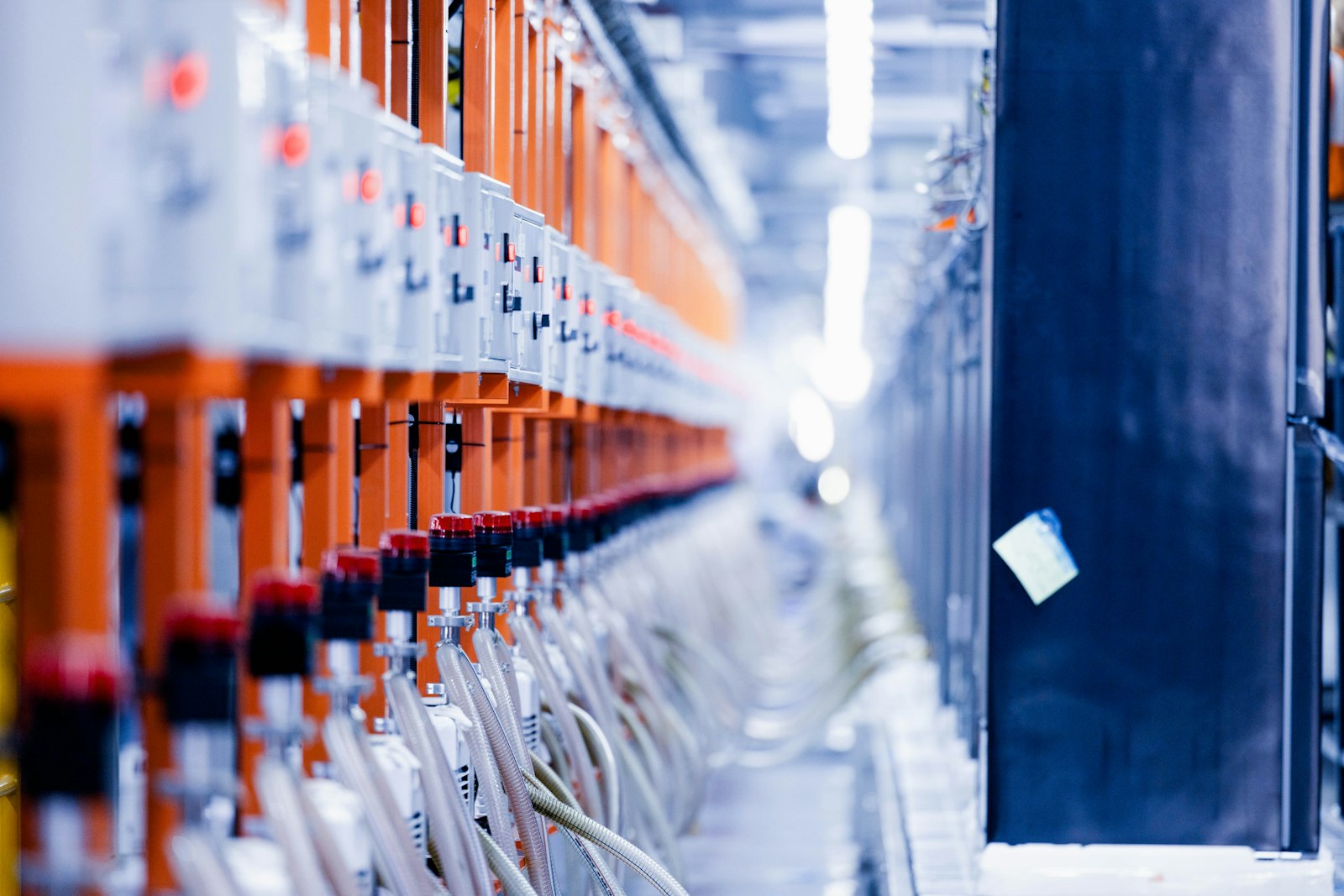 a row of orange and white electrical wires