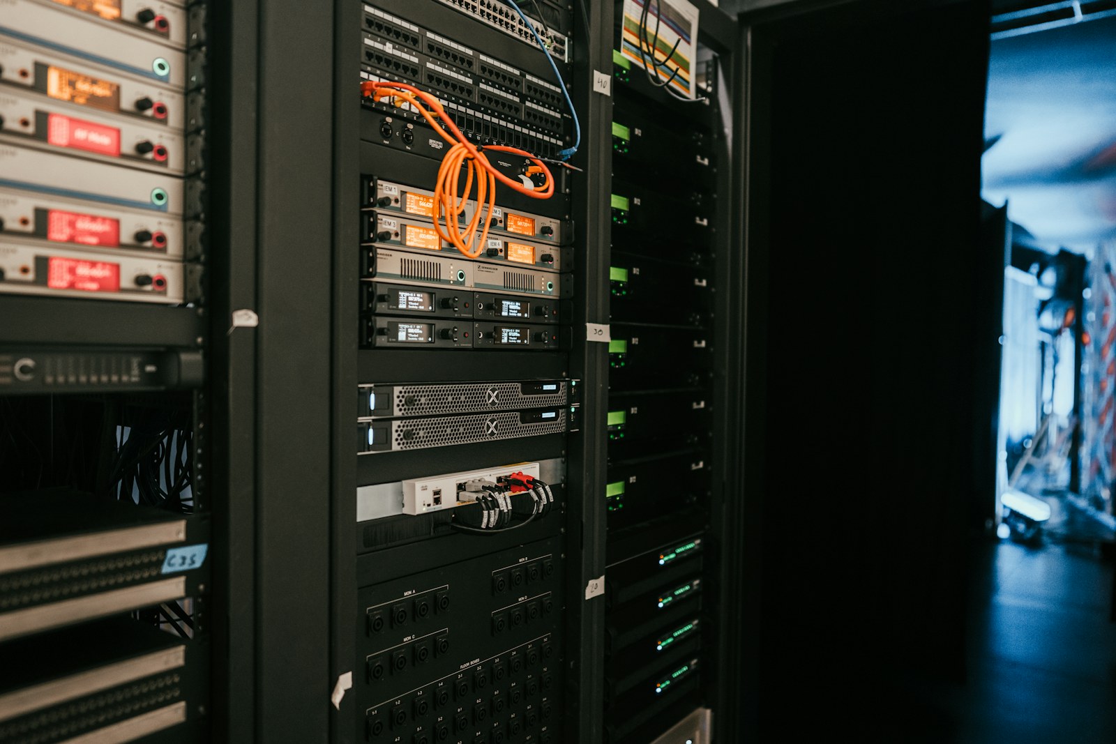 a rack of servers in a server room