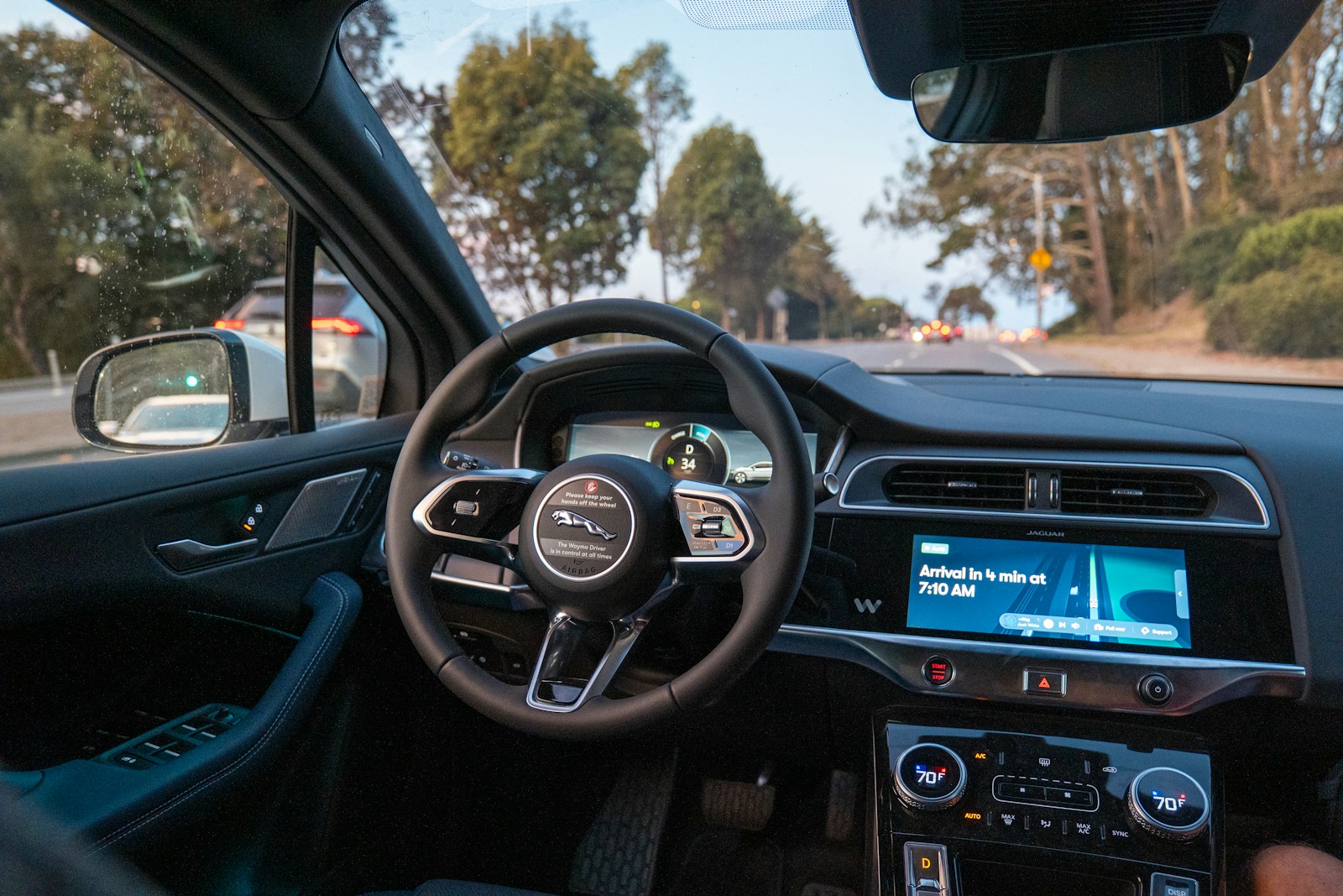 Inside a car, looking out at a road
