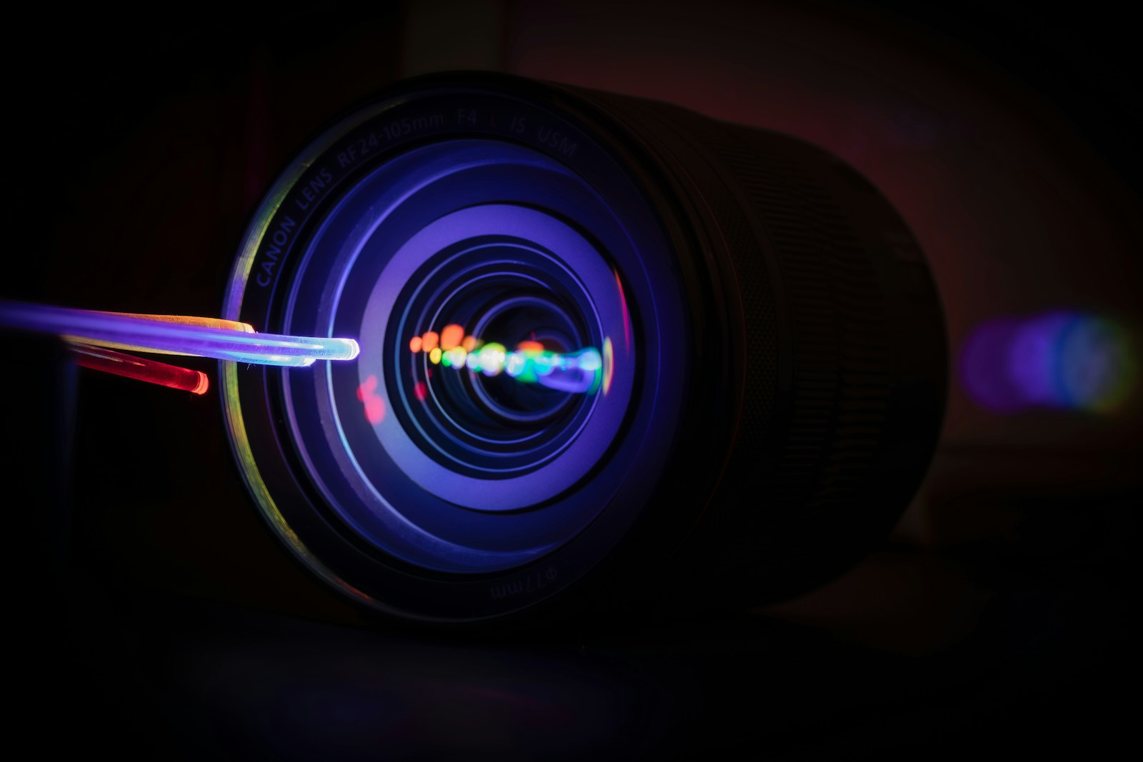 Colorful light refractions on a camera lens