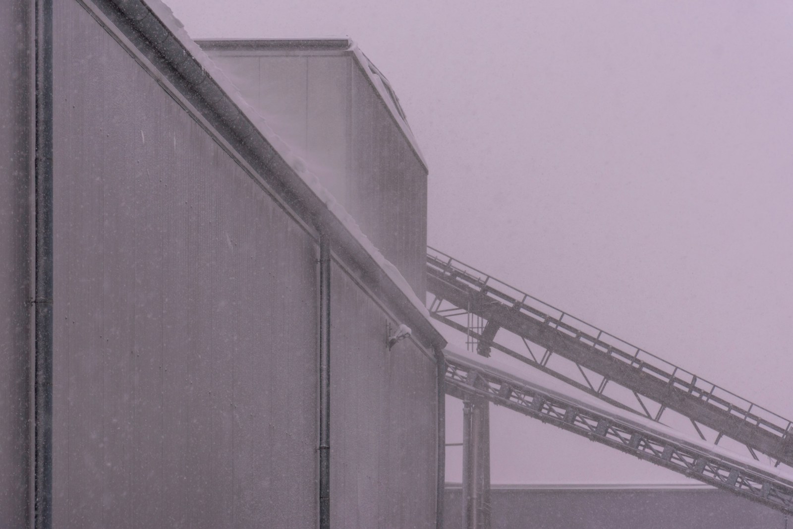 Industrial building with conveyor belt under snow