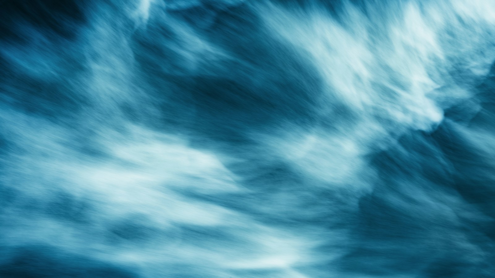 motion blurred blue ocean waves
